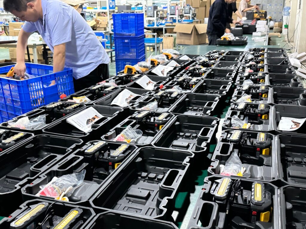 Workers are packing power tools